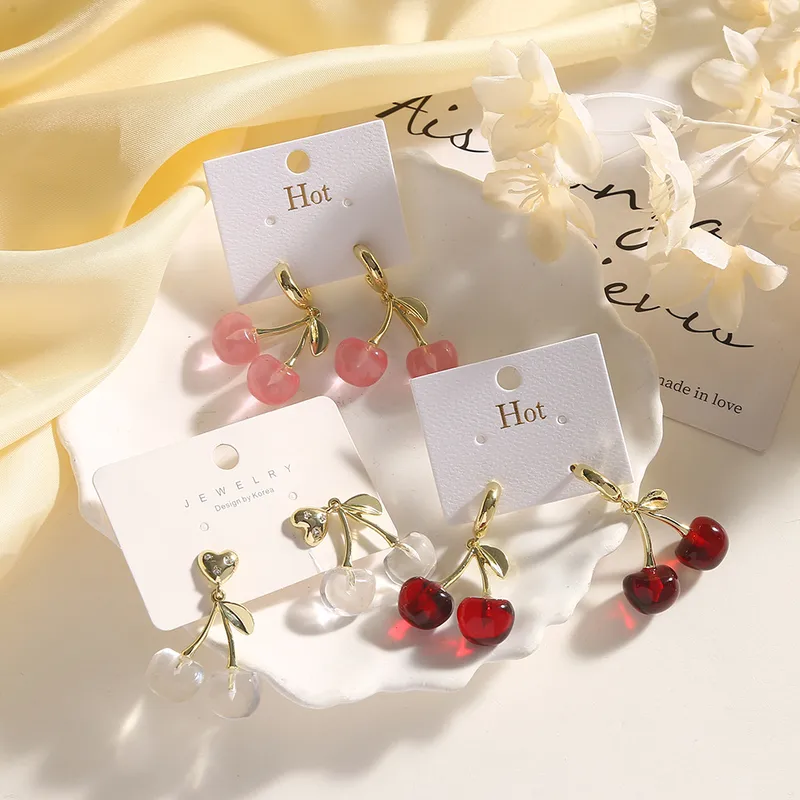 A pair of lovely cherry earrings and ear pins
